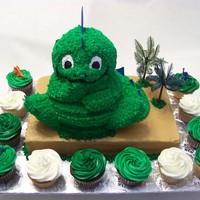 Spike chocolate cake with 1/2 vanilla 1/2 chocolate cupcakes. Spikes are fondant.
