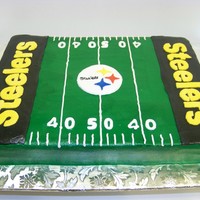 Steeler Time 1/2 sheet marbled white & chocolate, with buttercream frosting. Emblem,letters and numbers are in fondant. Thanks for looking