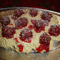 On Top Of Spagetti! This is a plate of spagetti and meatballs that are actually cupcakes! The meatballs are Rocher Ferro. The spagetti is tinted buttercream on...