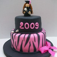 Hot Pink Zebra Print Graduation Cake 8" & 6" covered in MMF with fondant Figure. I also made cookies to match the cake covered in rolled buttercream.