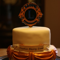 Lions Club Cake This cake is made from fondant and gumpaste. But I think the best part is the cake is the cake stand it's a CLOCK . I got the clock...
