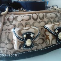 Coach Purse Cake My first purse birthday cake for a friend. Chocolate layer cake with amaretto buttercream, covered in chocolate fondant and Wilton black...