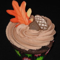 Fall Themed Cupcakes Chocolate cupcakes with vanilla frosting and fondant accents.