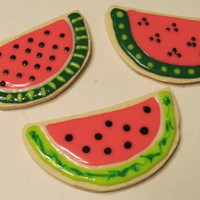 Watermelon Cookies Sugar cookies cut and decorated to resemble watermelon.