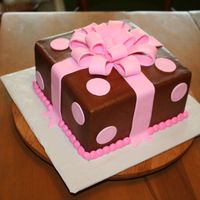 Polka Dots This is a buttercream iced cake with fondant dots and bow