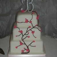 Apple Blossom 6, 8 and 10" square bottom styro, top 2 teirs vanilla with cherry chip filling. covered in mmf, flowers are mmf with tylose brushed...