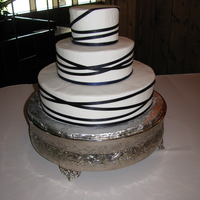 Abby's Random Ribbon Wraps All BC. Satin ribbon wrapped randomly around cakes. Attached with dots of bc icing. Florist was to add light green spider mums.