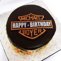 Harley Davidson Logo For Husband's 27Th Birthday This is my 3rd cake. The logo is an edible image I designed with photoshop. The flames were 1st piped onto a greased parchment paper with...