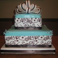 Birthday Cake Cake covered with fondant, Used vine mat to imprint then fill in vines on white part of fondant. Bow made of fondant.