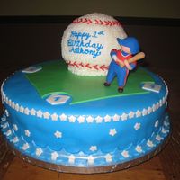 Baseball Cake 14" cake covered and decorated with fondant. Baseball cake covered with buttercream. Figurine made of fondant - copied from party...
