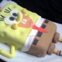 Spongebob Cake This was a one-layer 9 x 11 chocolate cake, carved to shape, torted and filled with chocolate buttercream...fondant covering and accents.