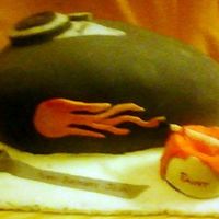 Motorcycle Cake This cake was a replica of a Motorcycle tank...actually, I added the "flamejob" myself (thus the can of paint and roll of tape on...