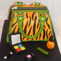 Zebra Purse Cake This was my first purse cake! I loved doing it since its so girly. Made to match the bday girls favorite colors orange/green. She chose...