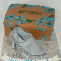 Shoe And Shoebox Box was carved from 2-9x13 sheet cakes stacked. Shoe is made of gumpaste.