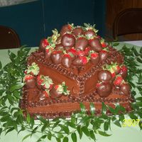 Grooms_Cake_3-10-07.jpg My first chocolate cake.. first groom's cake.... first time to chocolate cover strawberries... I was terrified!