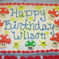 Super Mario Toad Cake My son wanted to have "Toad" from Super Mario Bros. games on his cake... then we added the "one up" which is the green...