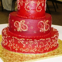 Indian Themed/henna Wedding Cake All yellow cake, iced in buttercream. The piping was done in white and painted with gold luster dust.