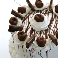 Chocolate Cherries And Whipped Cream I made this cake for my uncle's retirement party. Its 3 layers of chocolate cake filled and iced with whipped cream. Drizzled with...