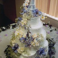 Eiffel Tower Wedding Cake This was a cake I made about 5 years ago for a friend's wedding. I can't remember all the flavors and fillings of the tiers......