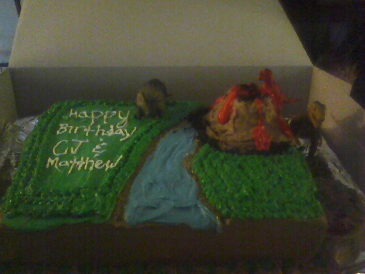 Jurasic Park Theme Dino Cake This cake was for two twins (5) yrs old Birthday. The frosting is butter cream and the cake is a simple butter cake. I put crushed oreos...