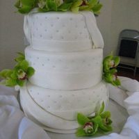 Wedding Cake my first wedding cake. served around 110 people. :) the orchids are real, not gumpaste.