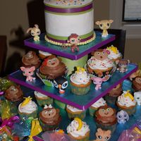 Littlest Pet Shop the birthday girl wanted some monkeys, so i made this cupcake tower and cutting cake for her with fondant monkeys and banannas.