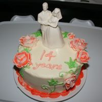 Our 14 Th Wedding Anniversary My husband and I have been married 14 years. On our wedding we had a white cake with white bc and white flowers and ivy vines. This cake I...