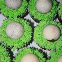 Golf Ball Cupcakes Chocolate cupcakes with vanilla buttercream green icing. The medallion on top are first coated with vanilla chocolate than the centres are...