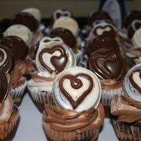 Marble Cupcakes I used the new mold from wilton that uses an oreo cookie in the medallions. The cupcakes are marble with chocolate and vanilla swill...