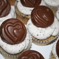 Oreo Cupcakes This is a white cake with crushed oreo cookies, covered with buttercream icing with crushed oreos. For medallions on top, I used a new...