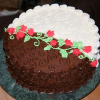 My First Cake This is my first cake. It was a yellow cake with buttercream icing in between layers with half white and half chocolate buttercream icing...