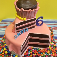 6Th Birthday Slice Of Cake dark chocolate and rainbow vanilla bean cake with vanilla bean buttercream filling, covered in MMF...