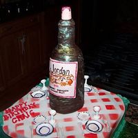 Dinner With Wine... Cake covered in buttercream with fondant tablecloth, plates, glasses, cutlery. Wine bottle hand carved and covered in fondant with painted...