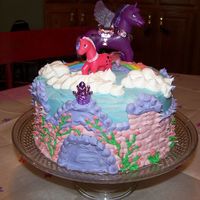 Little Pony Castle Cake My daughter wanted little pony castle cake. Made with 9in. cake pans, butter cream frosting, and $ store pony set.