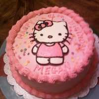 Hello Kitty Inspired by a wonderful cake here on CC...vanilla cake, raspberry filling, vanilla BC frosting. Cupcakes were the same flavors, wrappers...