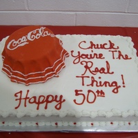 Coca Cola Birthday for a Coke lover. Sheet cake is marble and bottle top is cherry chip with vanilla cream. Covered with fondant.