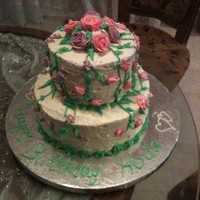Flowers Tiered Cake This is my first tiered cake. Made for my daughter's seventh birthday. She wanted a tiered cake with a cascade of flowers :)....