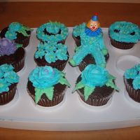 Wilton Course 1 Flowers Practicing flowers and a clown on cupcakes. These were done in course 1 of the Wilton method classes.