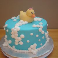 Rubber Ducky Bubble Bath Chocolate WASC cake with vanilla pudding filling. MFF with buttercream bubbles.The duck was modelled with fondant/gumpaste mix with added...