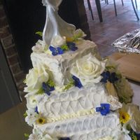 My First Wedding Cake peanut butter/choc cake w/ ivory butter cream. amazing flowers by my awesome bro in law and his partner!