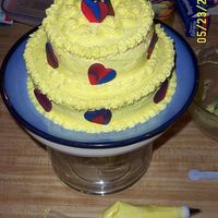 Marble Hearts And Tiers my first tiered cake - yellow and strawberry marble cake with yellow b/c and red/blue marbled fondant hearts
