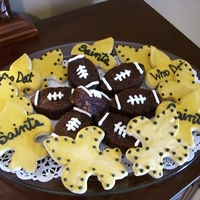 Saints Cookies Fleur de lis sugar cookies covered in royal icing and chocholate chocholate chip brownies. I made these for these for a superbowl party.