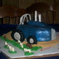 Pulling Tractor This cake is for a charming little boy hitting the terrible two's. It is suppose to be a pulling tractor like the one the boy's...