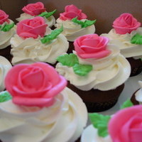 Roses For A 50Th Simple chocolate cupcakes with coconut frosting and topped with a rose. An order for a 50th birthday for someone's friend.