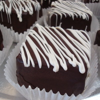 Mini-Cake Great elegant alternative to cupcakes! 2x2, covered with chocolate ganache and drizzled with white chocolate.