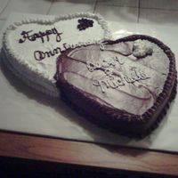 Anniversary Cake this cake is white cake, white icing, choc cake, choc icing in heart shape.