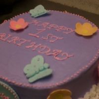 Cimg5272.jpg Buttercream w gumpaste decorations. First time using Viva method