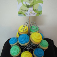 Festive Birthday Cupcakes White cupcakes with colorful white chocolate frosting.