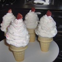 Ice Cream Cone Cupcakes 1st attempt at the ice cream cone....strawberry cupcake w/ vanilla buttercream icing...(not baked in the cone)