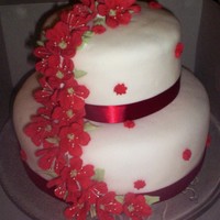 Red And White Wedding Engagement I made this cake for a friend who's son was proposing on Christmas Eve. His girlfriend was so surprised! fondant with royal flowers